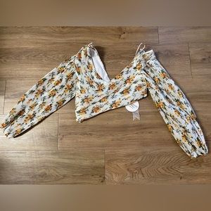 Sexy V-neck pleated Golden Surfer floral-print blouse.